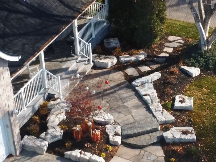 Blending Stone and Nature for a Grand Welcome