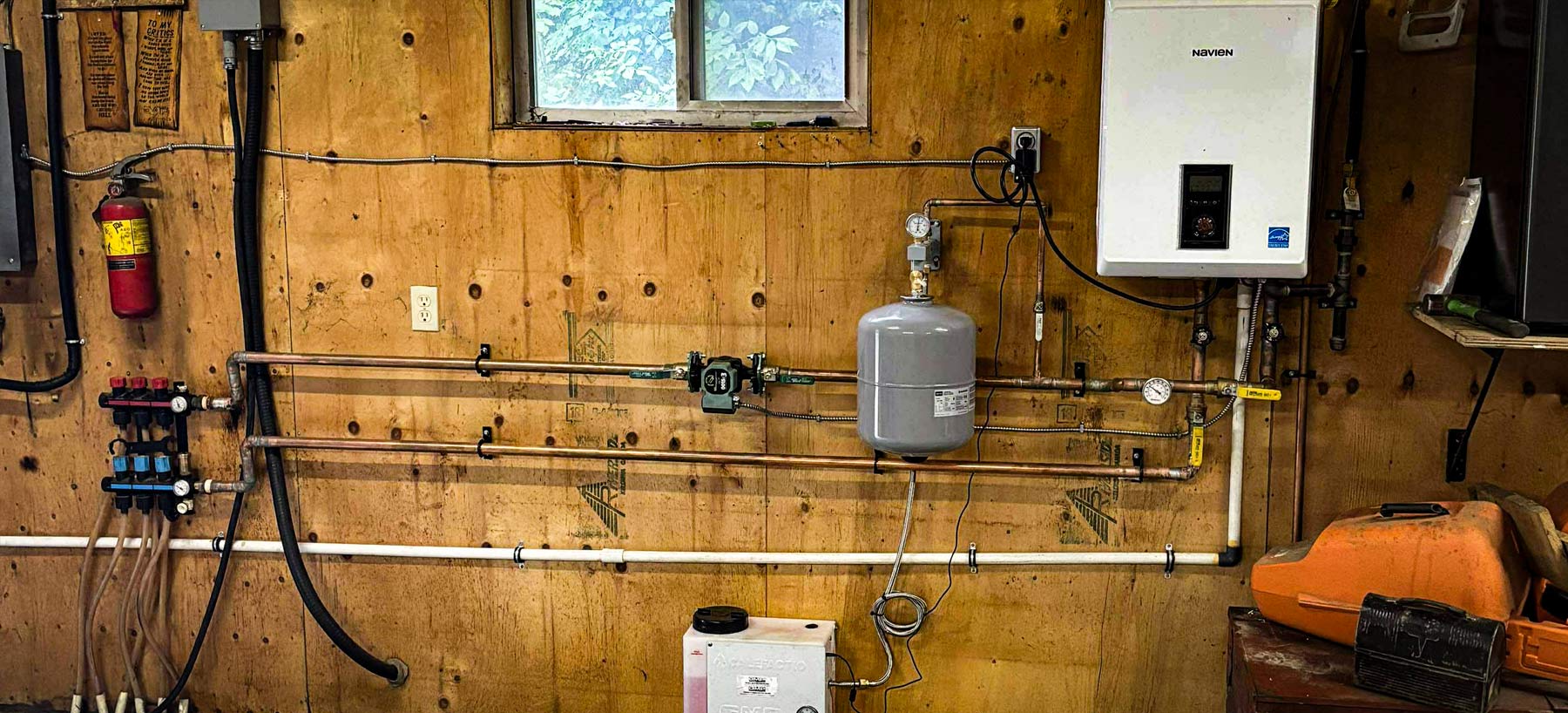 Mechanical room with NapAir heating equipment and clean piping installation